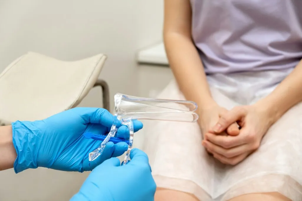 Gynecologist holding vaginal speculum in his hands closeup.Women's health.
